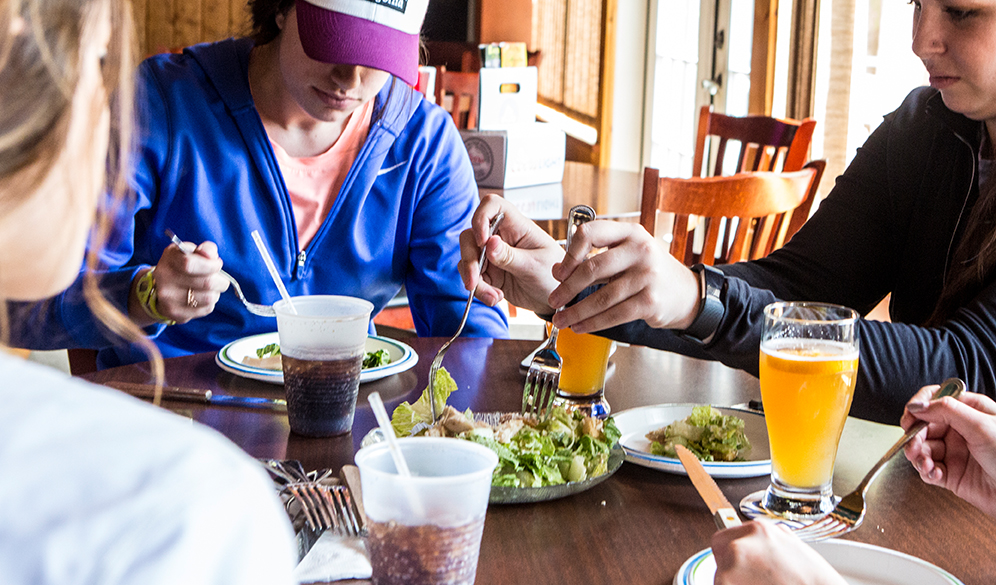 group enjoying salad in inlet